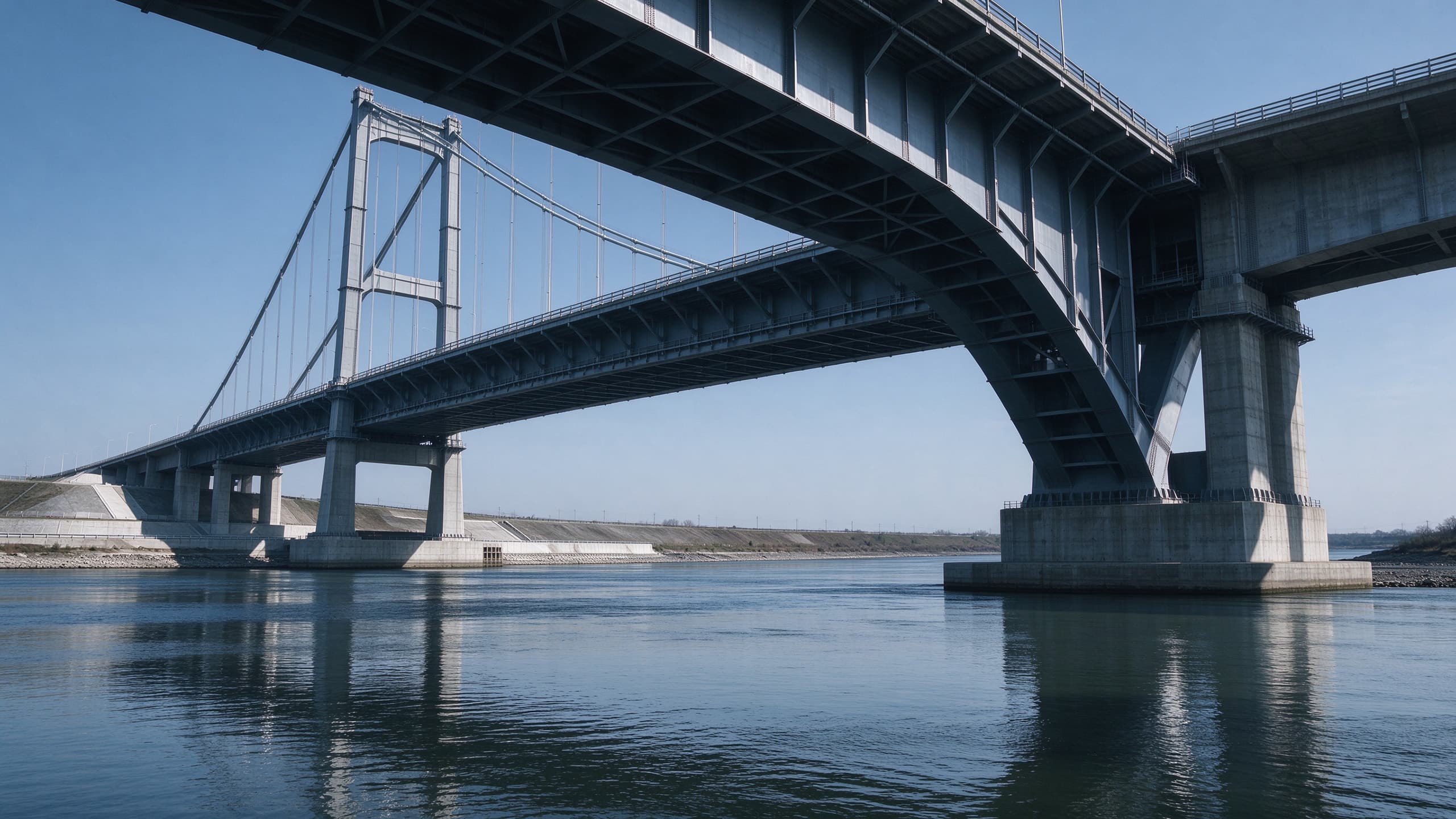Steel plate girder highway bridge span crossing a river
